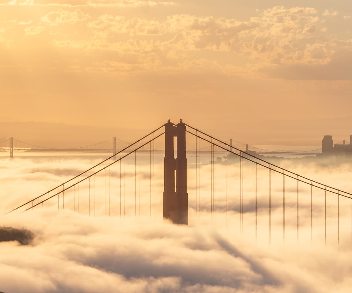 349 megapixels! A very high resolution, large-format VAST photo print of sunrise over the Golden Gate Bridge and the San Francisco skyline with beautiful fog filling the San Francisco bay and the Marin Headlands in the foreground; fine art sunrise photograph created by Jeff Lewis in San Francisco, California.