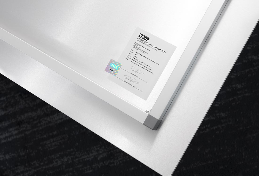 A picture of the seal of authenticity with artist signature affixed to the back of an ultra-high-resolution VAST photo