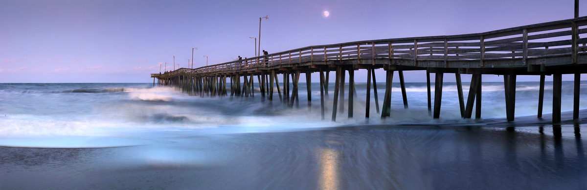 293 megapixels! A very high resolution, large-format VAST photo print of a pier on the beach at dusk with the moon in the background; photograph created by Phil Crawshay in Virginia Beach Pier, Virginia.