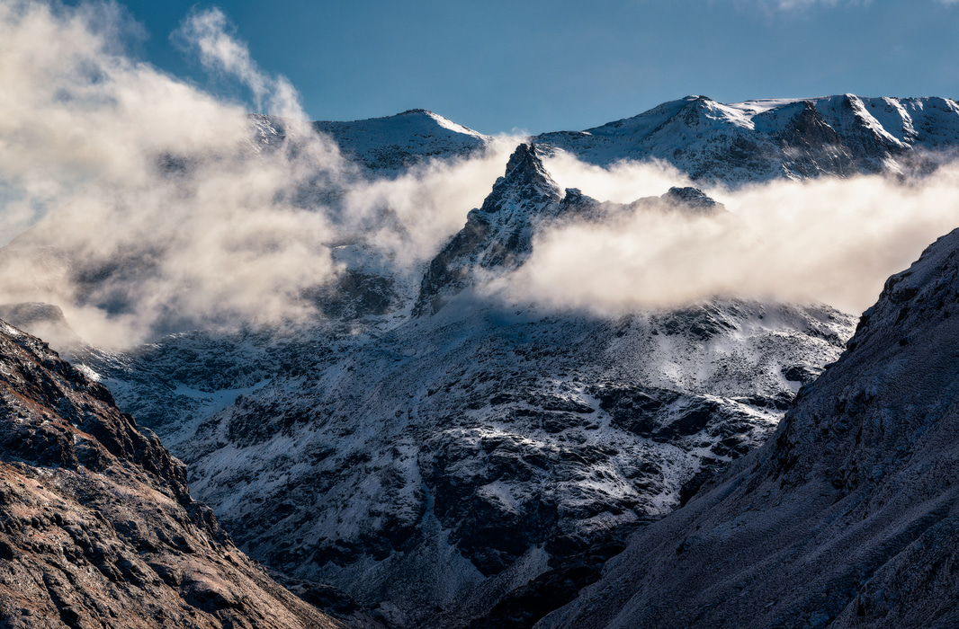 121 megapixels! A very high resolution, wall artwork photo of a snowy mountain with clouds in the Alps; photograph created by Duilio Fiorille in Vallon d'Ambin, France.