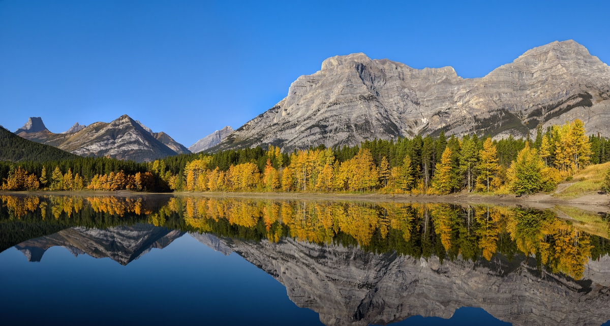 2,018 megapixels! A very high resolution, large-format VAST photo print of an autumn morning at a lake with a perfect reflection of mountains and a blue sky; landscape photograph created by Scott Dimond in Wedge Pond, Kananaskis Country, Alberta, Canada.