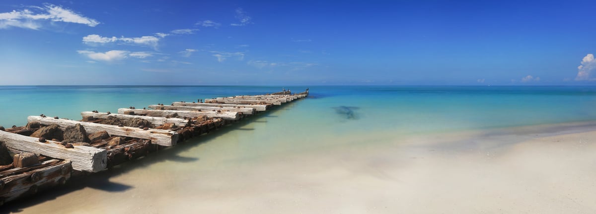 296 megapixels! A very high resolution, long-exposure photo of a beach with the Gulf of Mexico and an old pier; seascape photograph created by Phil Crawshay in Coquina Beach, Bradenton, Florida.