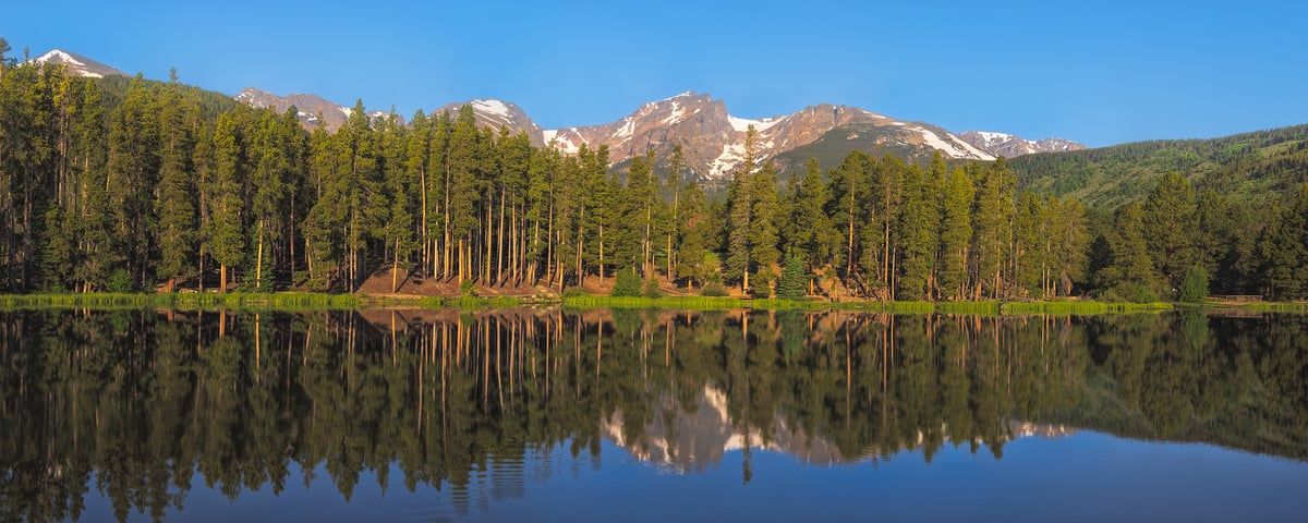 1,090 megapixels! A very high resolution, large-format VAST photo print of a calm lake with a forest in the background and mountains in the distant background; landscape nature photograph created by John Freeman in Sprague Lake, Rocky Mountain National Park, Colorado.