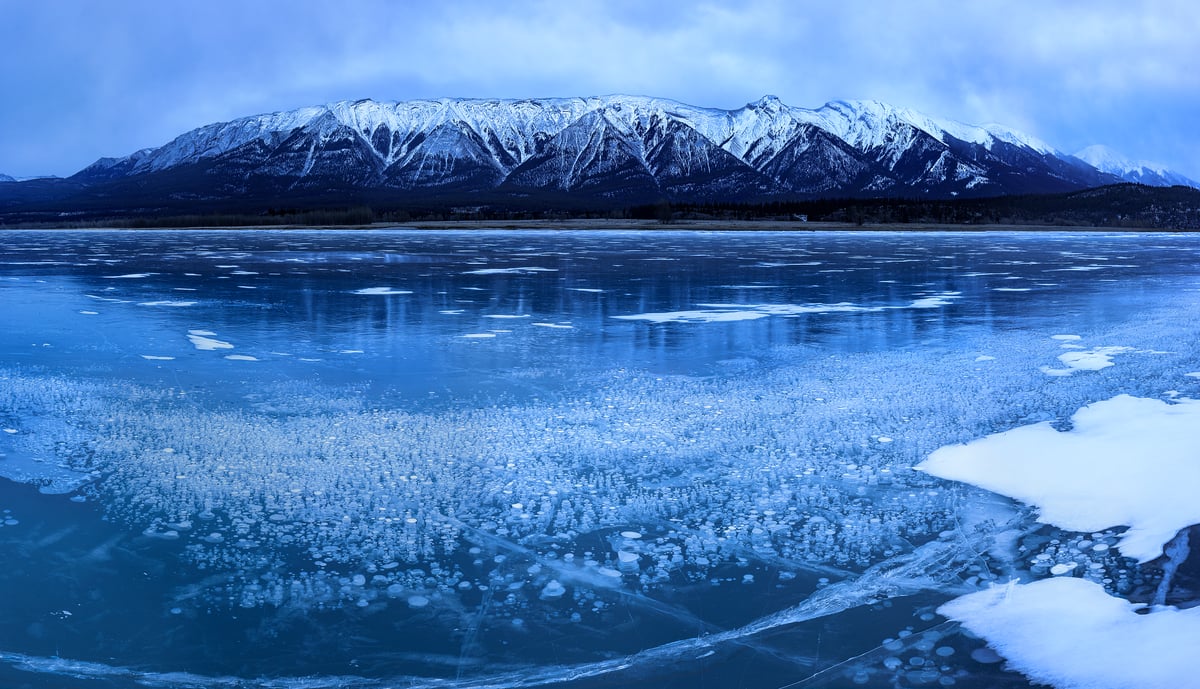 499 megapixels! A very high resolution, large-format landscape photo print of a frozen lake with a mountain range in the background; winter photograph created by Scott Dimond at Abraham Lake in Alberta, Canada.