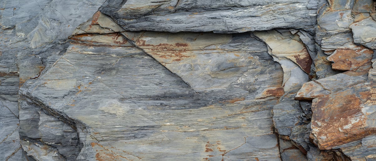 216 megapixels! A very high resolution texture photo of grey and rust slate textures; gigapixel image available to be licensed and downloaded as a digital file from VAST; photograph created by David Lineton.