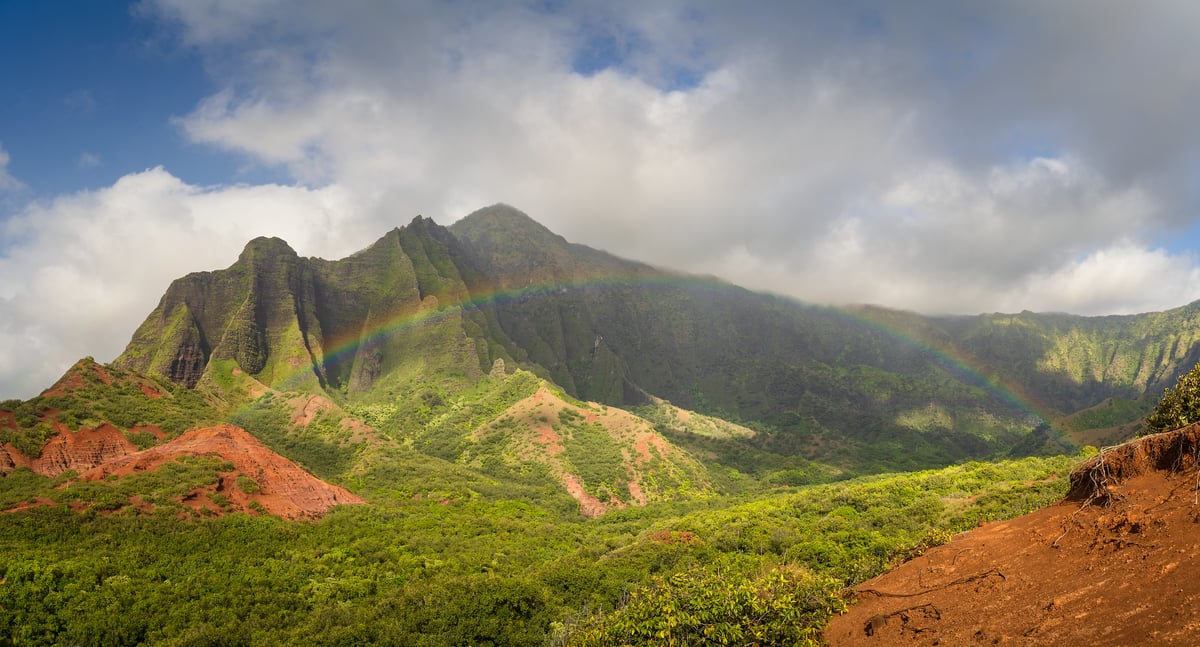 149 megapixels! A very high resolution, large-format VAST photo print of a rainbow in front of a beautiful landscape with verdant mountains; photograph created by Jeff Lewis in Kalalau Valley, Hawaii.
