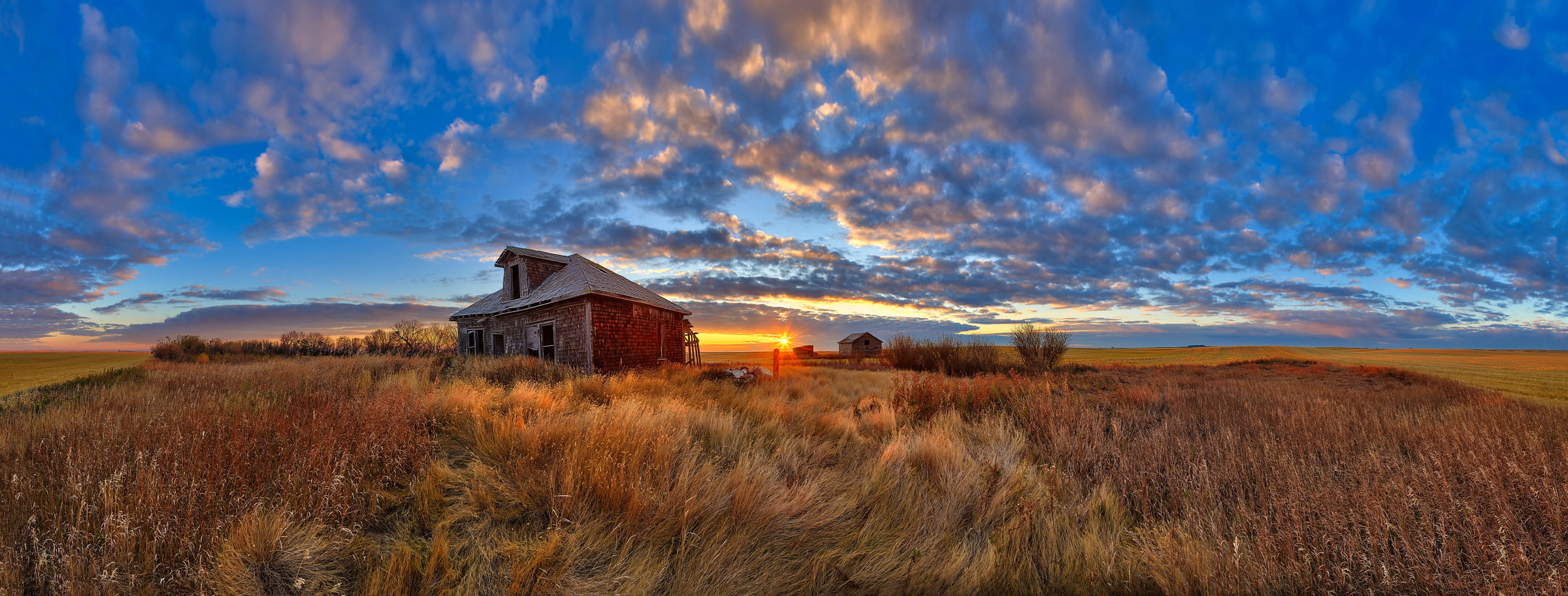 A very high resolution, large-format VAST photo of farmland, grasslands, the prairie, and an old abandoned house; fine art landscape photo created at sunset by Scott Dimond on the Great Plains in Alberta, Canada